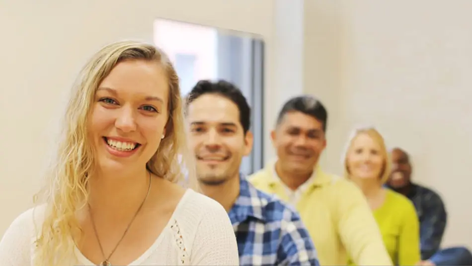 Group of people smiling at Santa Clara Meditation center showing happiness and inner peace through meditation