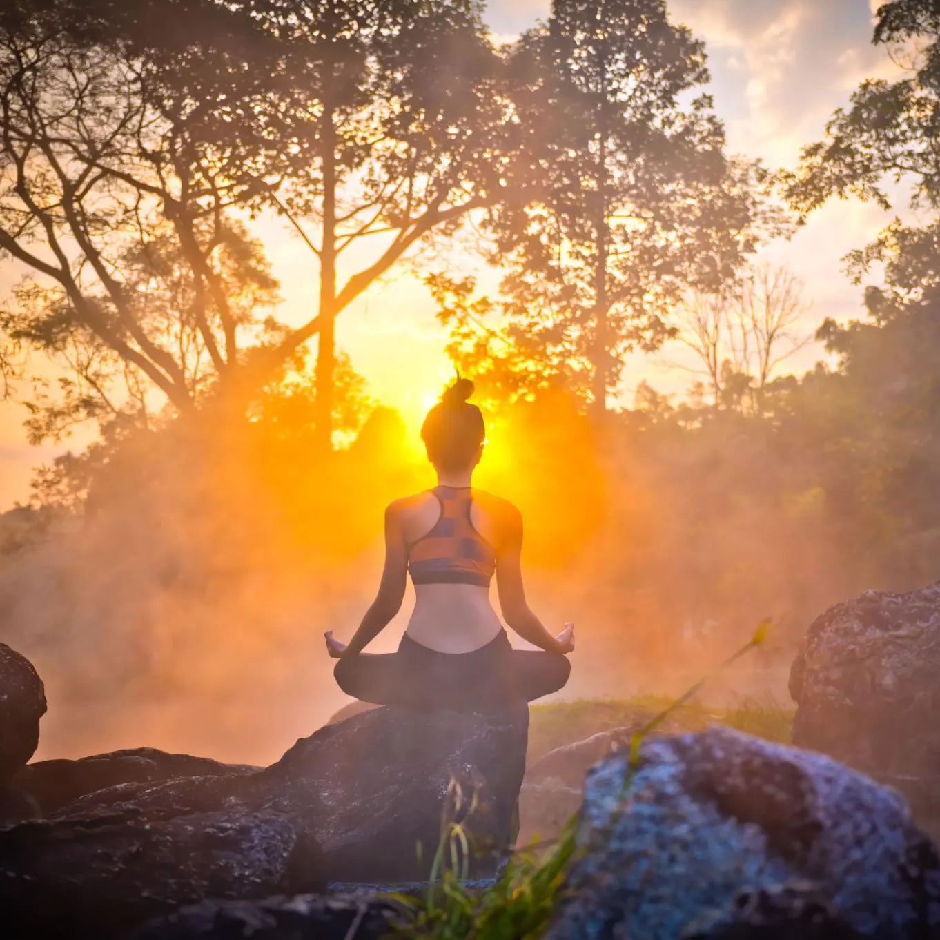 person meditating peacefully in sunlight overcoming stress and anxiety